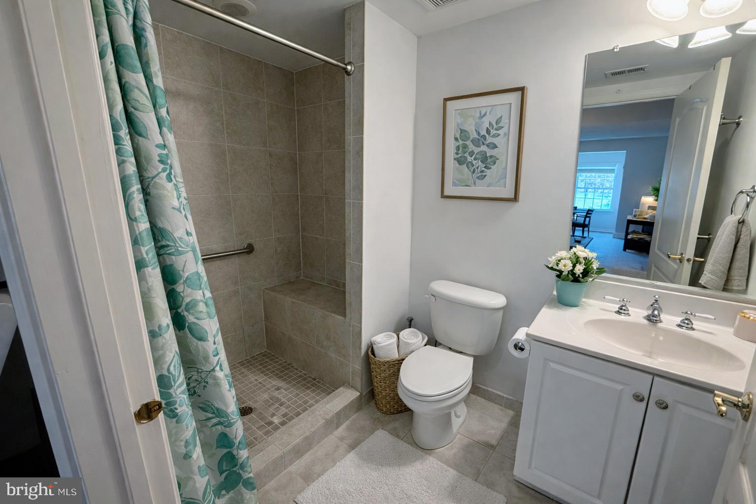 5652 Wheelwright Way Haymarket, VA 20169 - Photo 27 of 32 a bathroom with a sink and a mirror