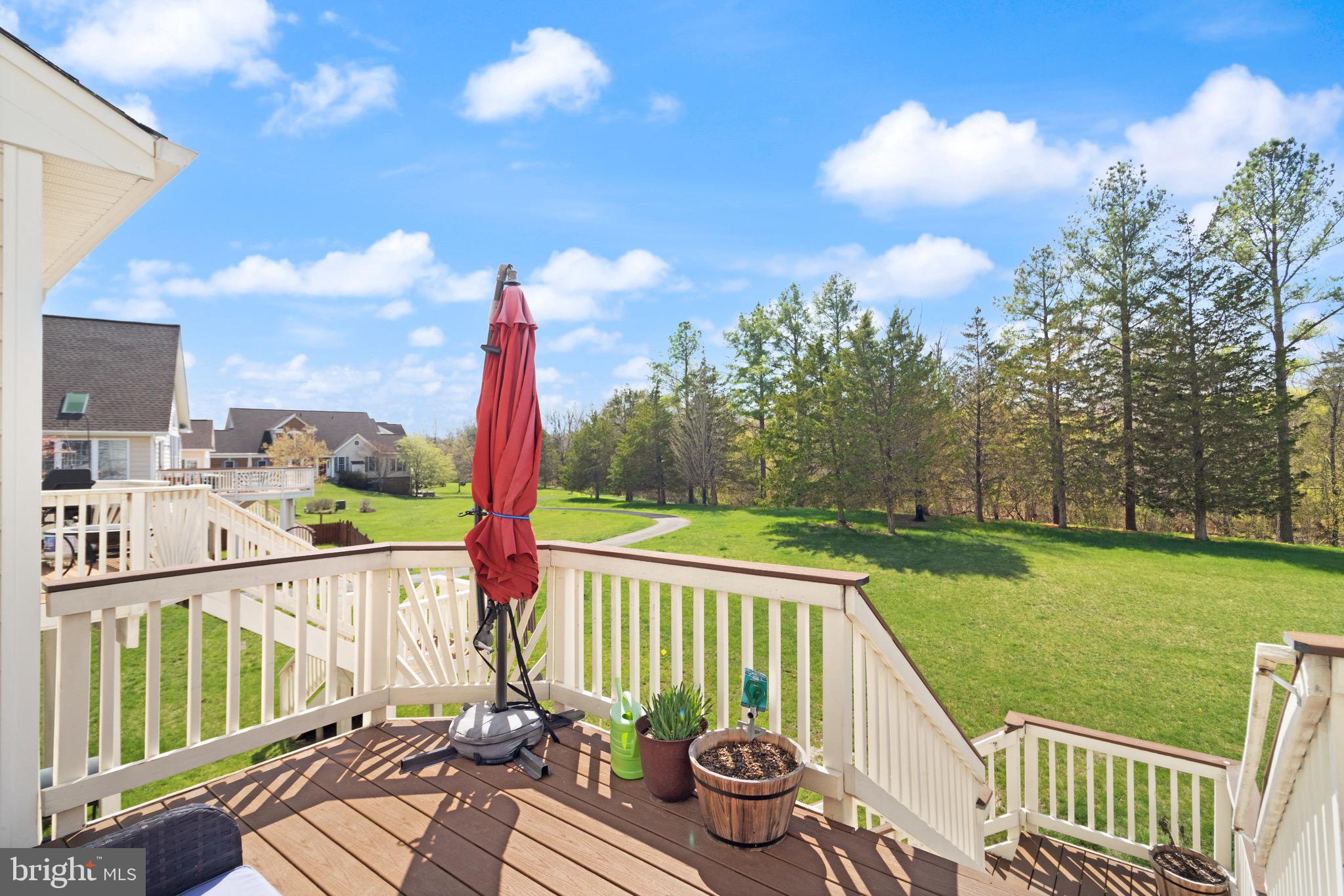 5652 Wheelwright Way Haymarket, VA 20169 - Photo 28 of 32 a view of a deck with a chair and floor to ceiling window