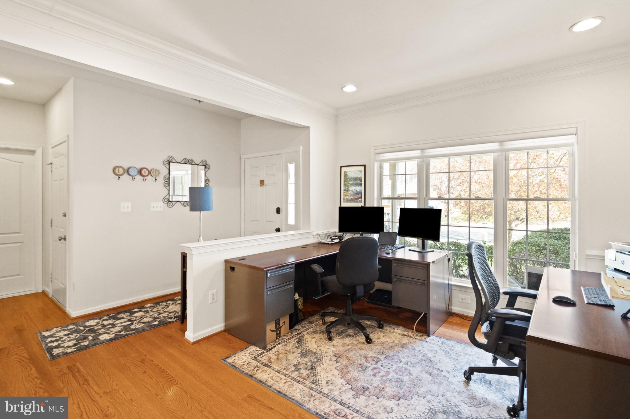 5652 Wheelwright Way Haymarket, VA 20169 - Photo 10 of 32 a view of a workspace with furniture and a window