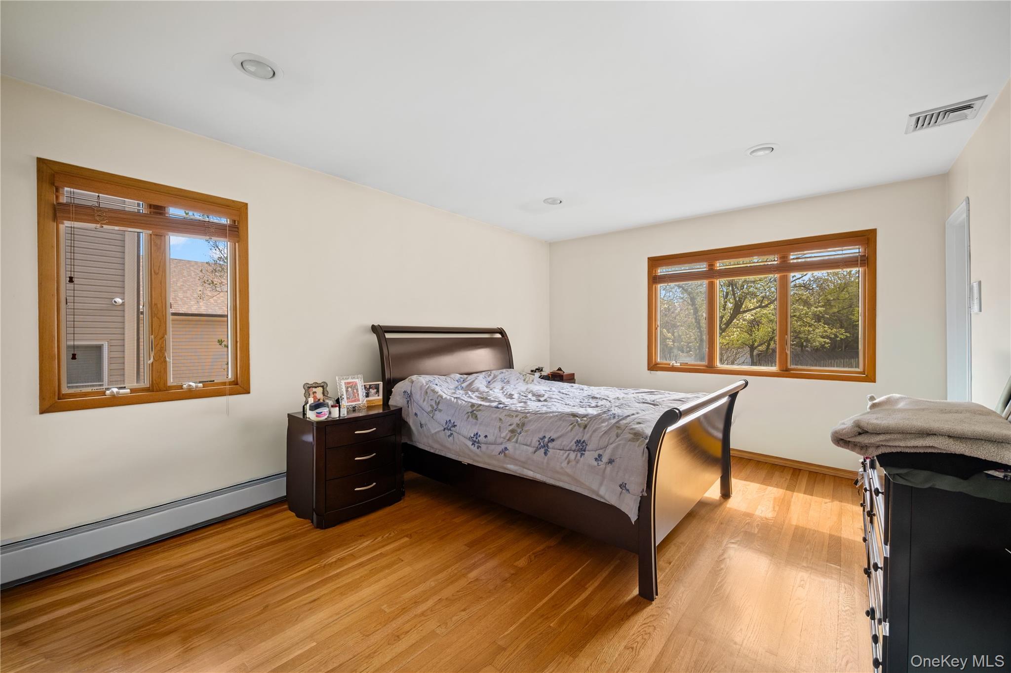 150 Roxton Road Plainview, NY 11803 - Photo 11 of 25 a bedroom with a bed and a window