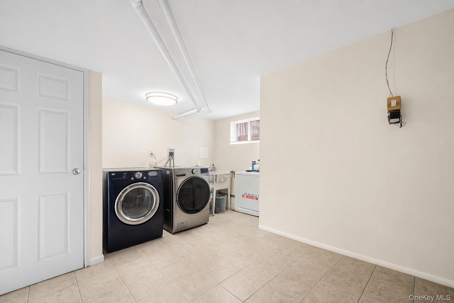 150 Roxton Road Plainview, NY 11803 - Photo 19 of 25 a utility room with dryer and washer