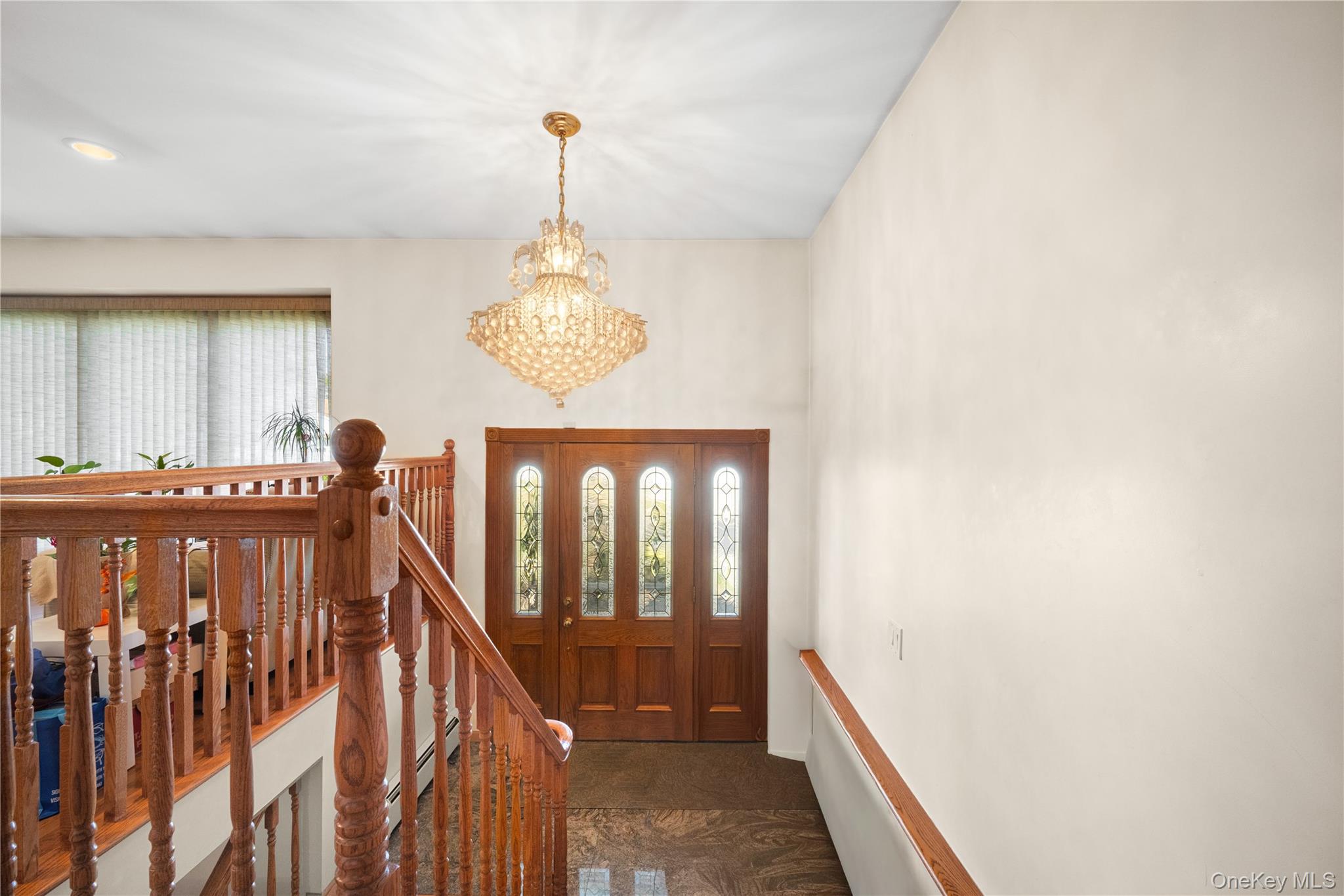 150 Roxton Road Plainview, NY 11803 - Photo 2 of 25 a view of a hallway with wooden floor