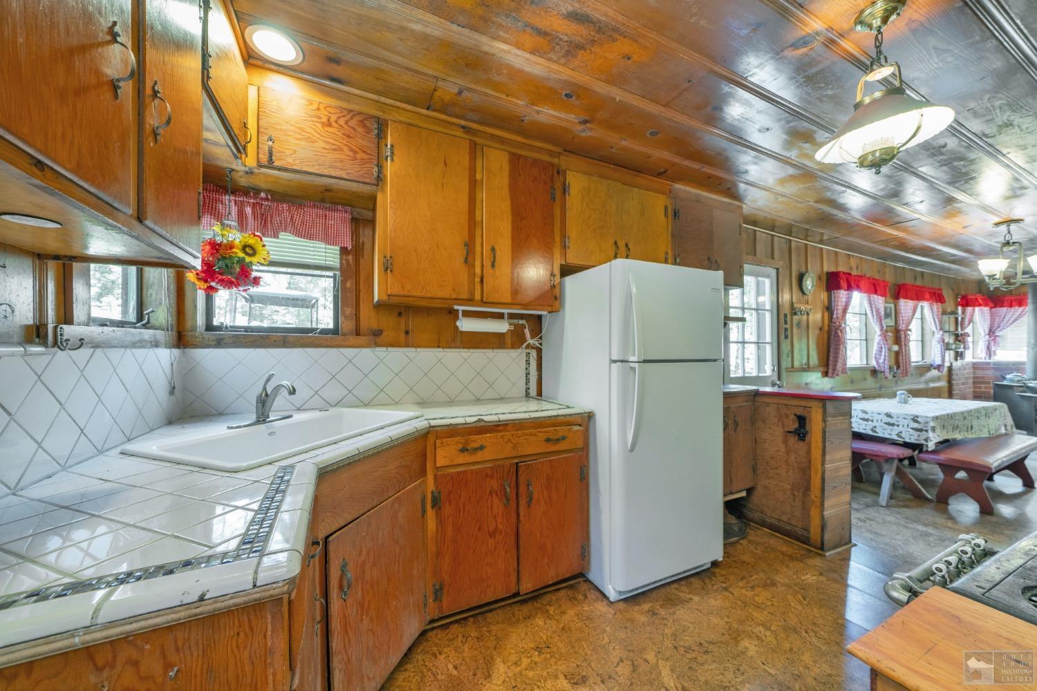 26 Sciots Tract Twin Bridges, CA 95735 - Photo 15 of 27 a utility room with refrigerator and washer