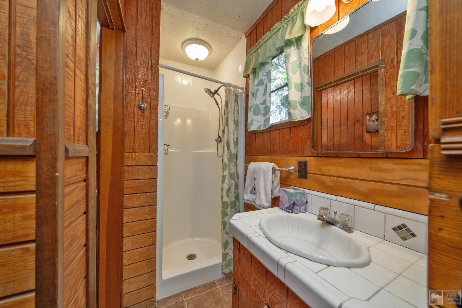 26 Sciots Tract Twin Bridges, CA 95735 - Photo 16 of 27 a bathroom with a sink and a mirror