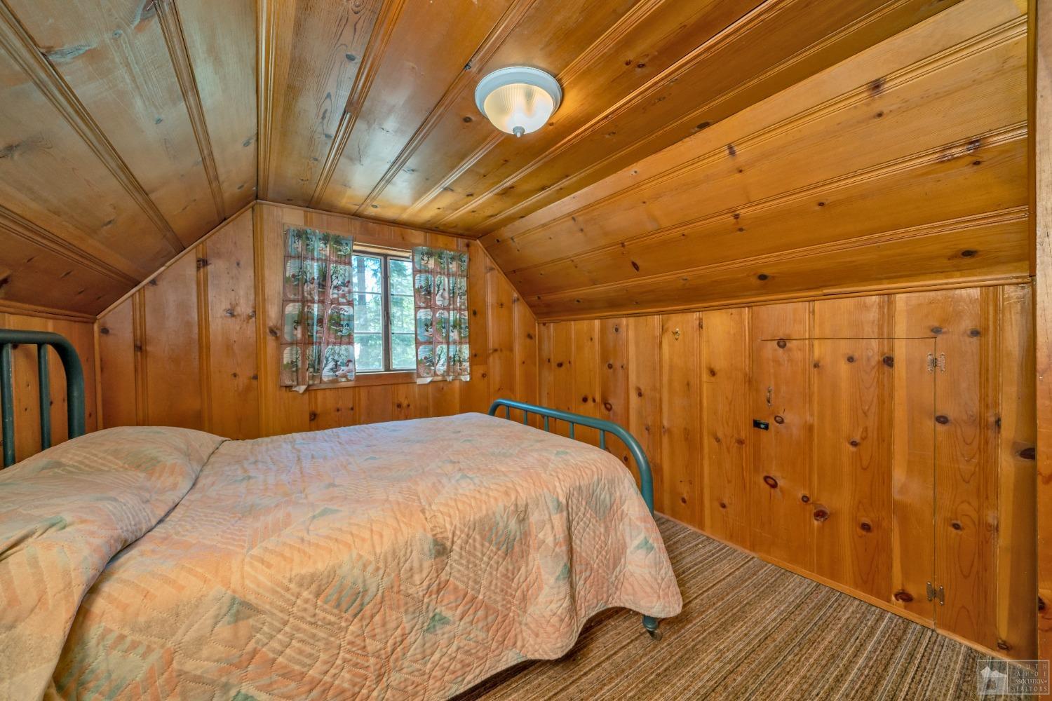 26 Sciots Tract Twin Bridges, CA 95735 - Photo 20 of 27 a bed sitting in a spacious bedroom next to a window