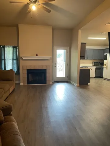 a living room with furniture and a fireplace
