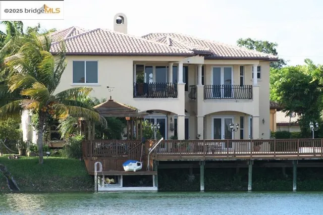 a front view of house with yard and outdoor seating
