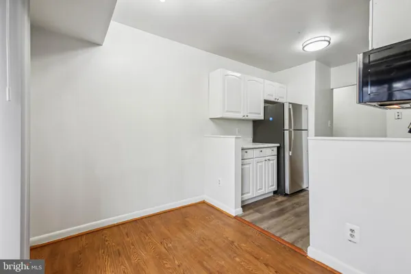a kitchen with a refrigerator a stove top oven a sink and dishwasher