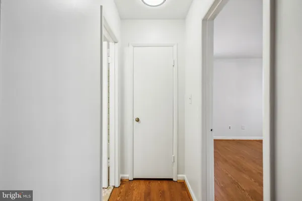 a view of room with window and hardwood