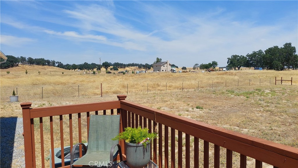 4250 Osborn Road Flournoy, CA 96021 - Photo 19 of 68 a view of a balcony with wooden floor and lake view