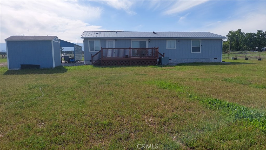 4250 Osborn Road Flournoy, CA 96021 - Photo 22 of 68 a view of a house with a backyard and wooden fence