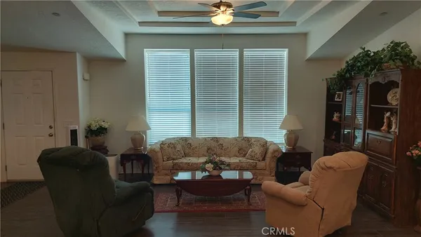 a bedroom with bed and a chandelier