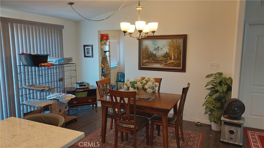 4250 Osborn Road Flournoy, CA 96021 - Photo 30 of 68 a view of a dining room with furniture and chandelier