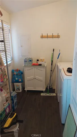 a bathroom with a sink a mirror a toilet and shower