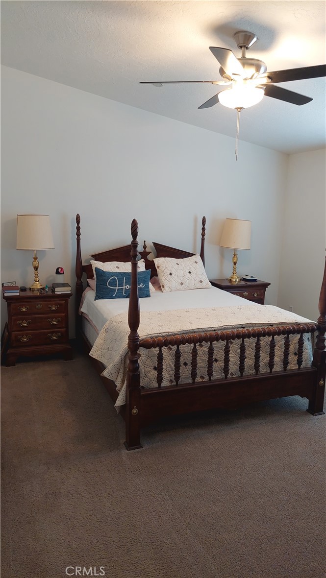 4250 Osborn Road Flournoy, CA 96021 - Photo 37 of 68 a bedroom with bed and a chandelier