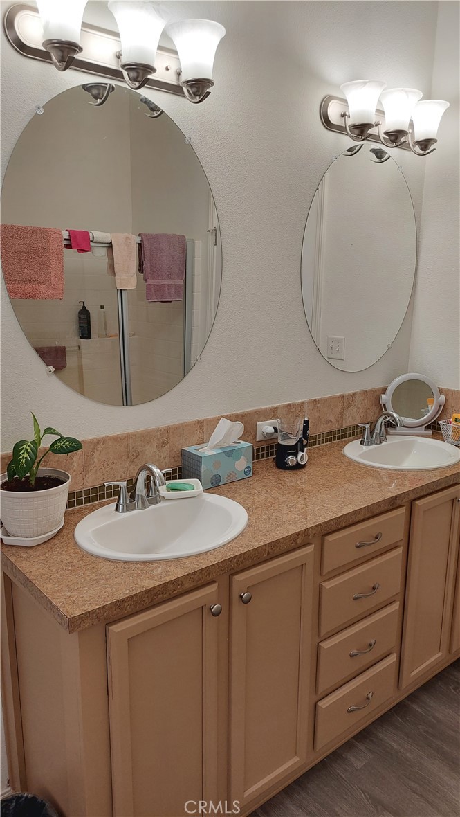 4250 Osborn Road Flournoy, CA 96021 - Photo 41 of 68 a bathroom with a double vanity sink and a mirror