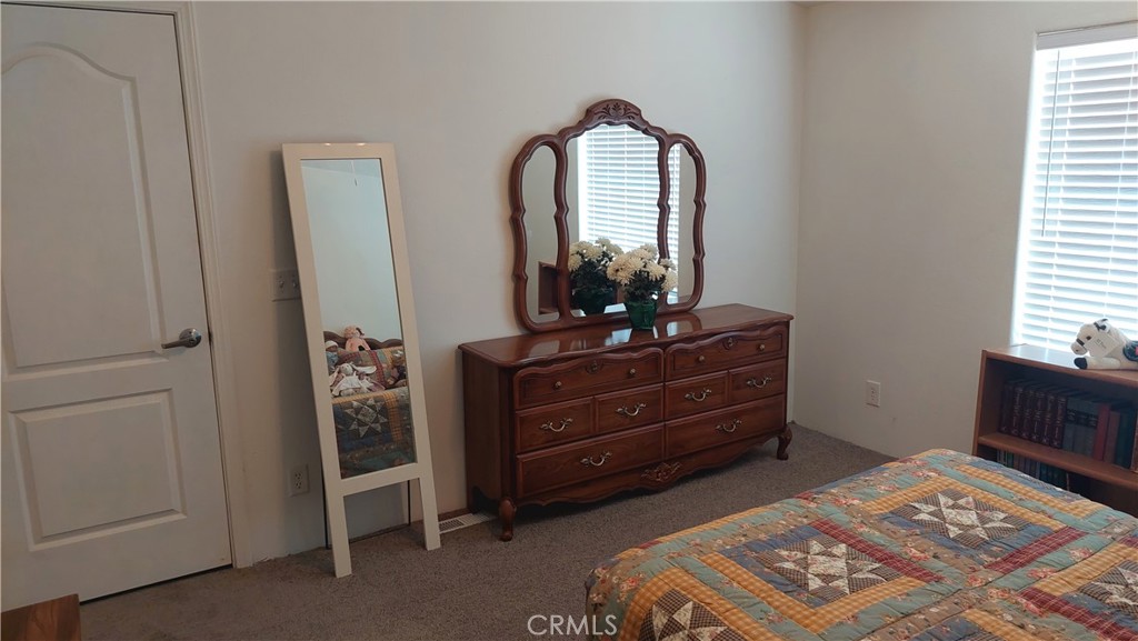 4250 Osborn Road Flournoy, CA 96021 - Photo 43 of 68 a room with a dresser and a mirror