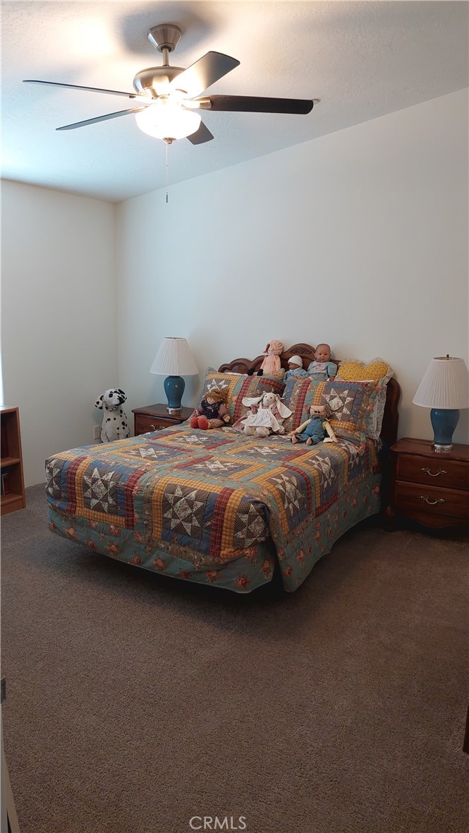 4250 Osborn Road Flournoy, CA 96021 - Photo 44 of 68 a bedroom with bed and a ceiling fan