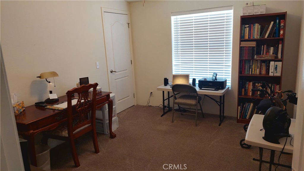 4250 Osborn Road Flournoy, CA 96021 - Photo 50 of 68 a view of a workspace with furniture and a window