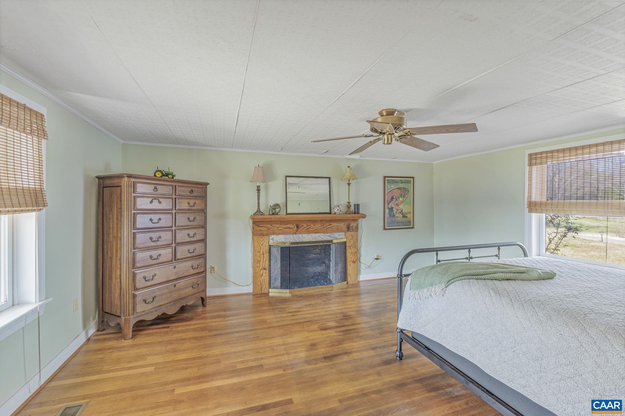 1353 Banton Shop Road Dillwyn, VA 23936 - Photo 13 of 57 a bedroom with a bed and a fireplace