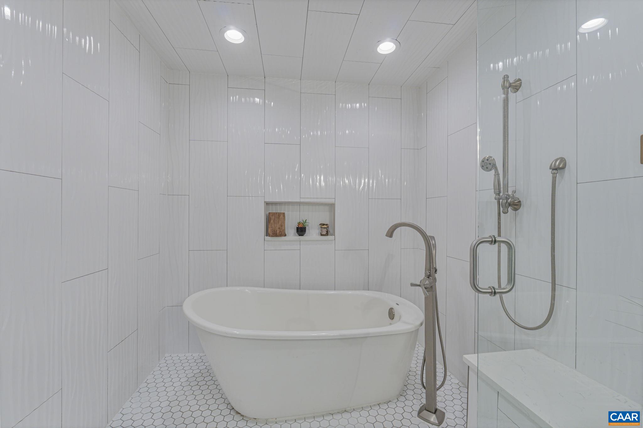 1353 Banton Shop Road Dillwyn, VA 23936 - Photo 19 of 57 a bathroom with a bathtub and a shower