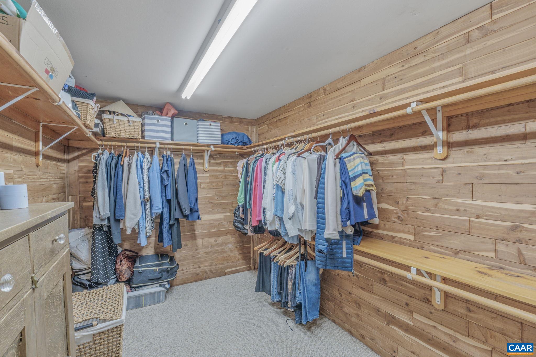 1353 Banton Shop Road Dillwyn, VA 23936 - Photo 20 of 57 a view of walk in closet with clothes and shoes