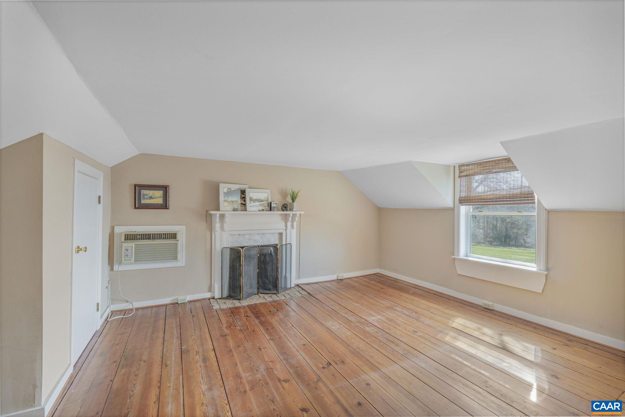1353 Banton Shop Road Dillwyn, VA 23936 - Photo 28 of 57 an empty room with windows fireplace and a sink