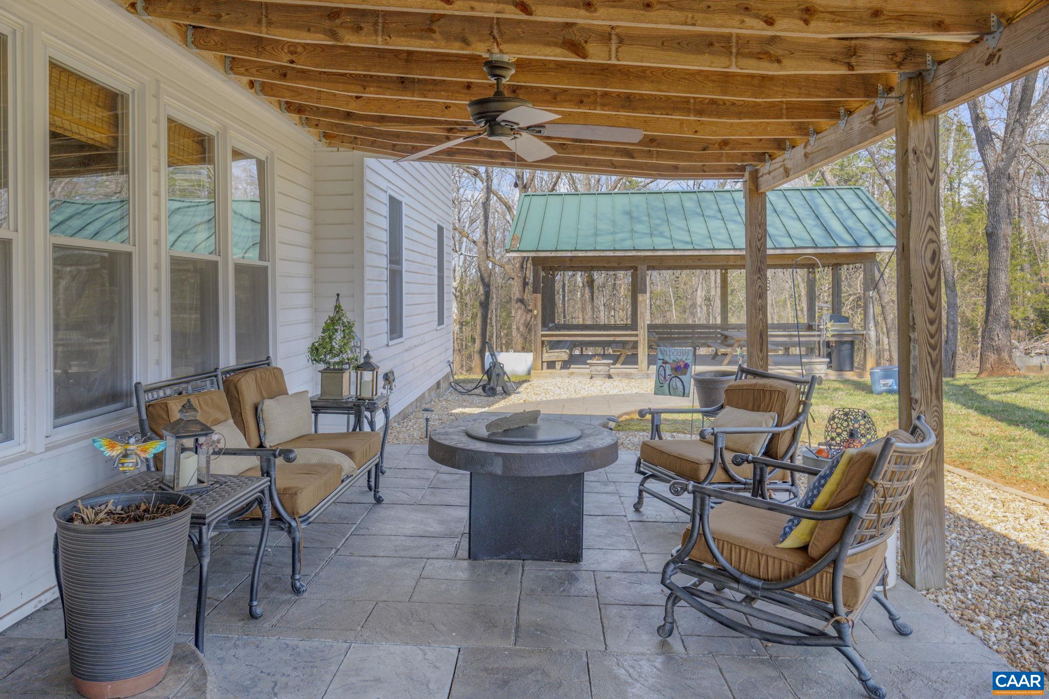1353 Banton Shop Road Dillwyn, VA 23936 - Photo 33 of 57 a building outdoor space with patio furniture and potted plants