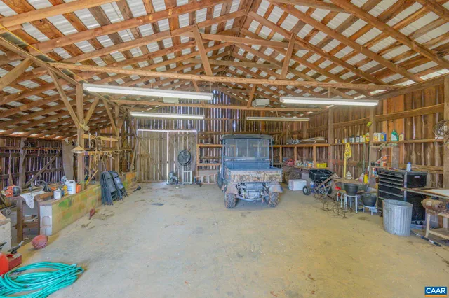a view of a house with a yard patio and sitting area
