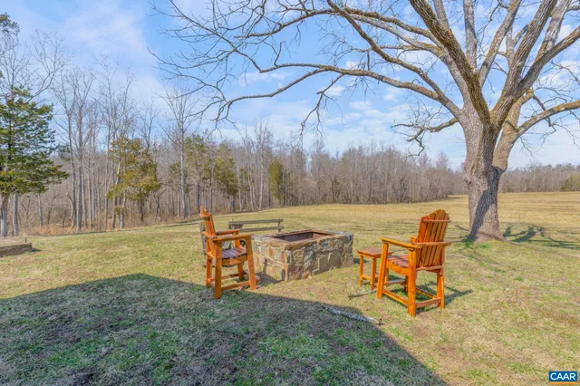 a view of swimming pool with seating area