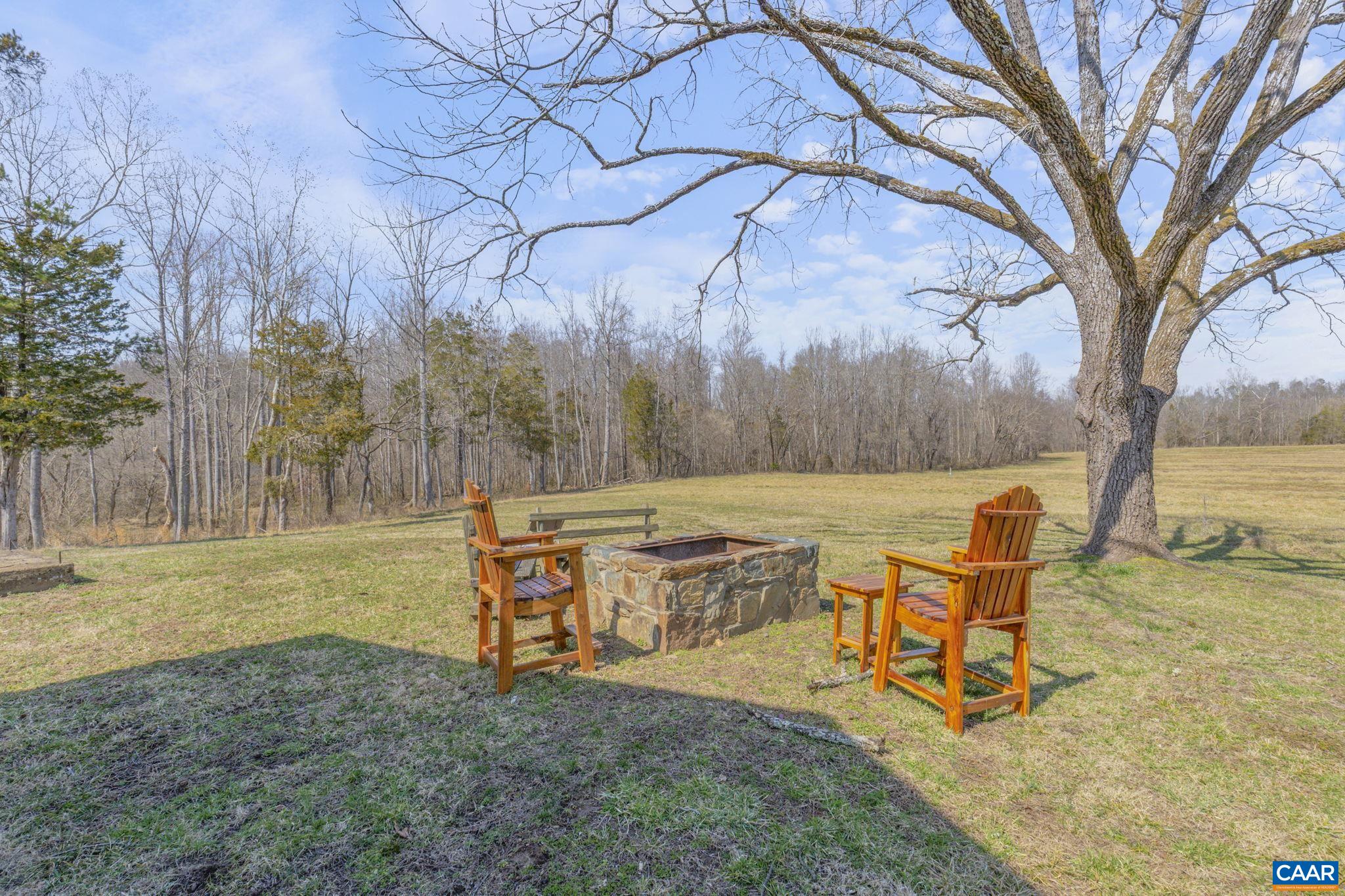 1353 Banton Shop Road Dillwyn, VA 23936 - Photo 44 of 57 a backyard of a house with table and chairs