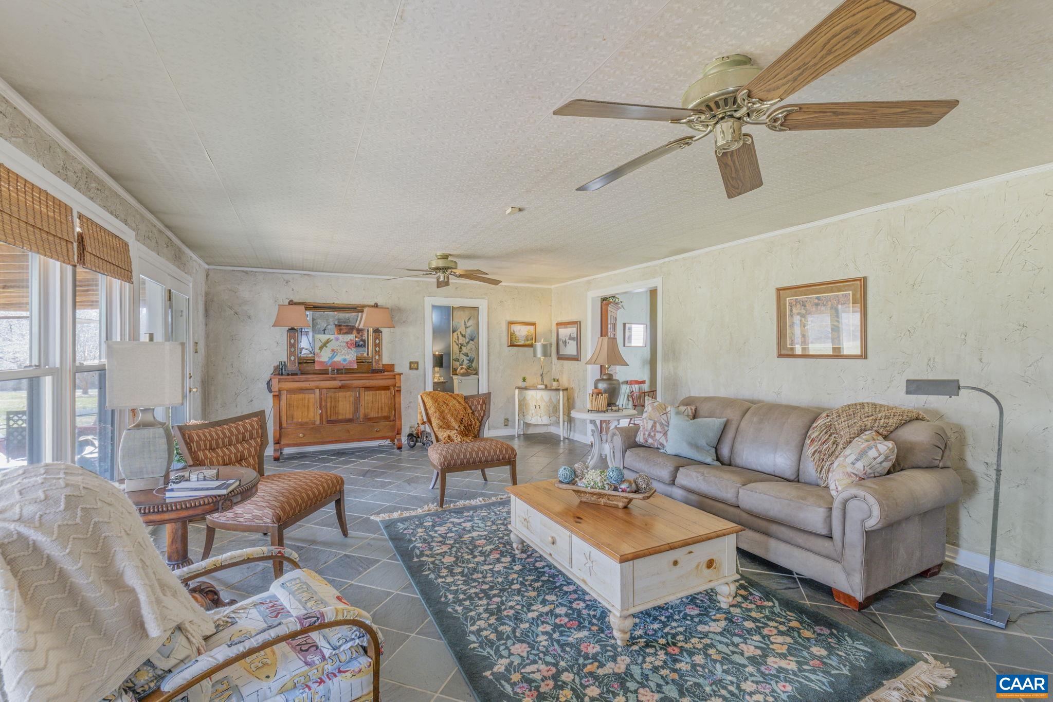 1353 Banton Shop Road Dillwyn, VA 23936 - Photo 5 of 57 a living room with furniture a rug and a window