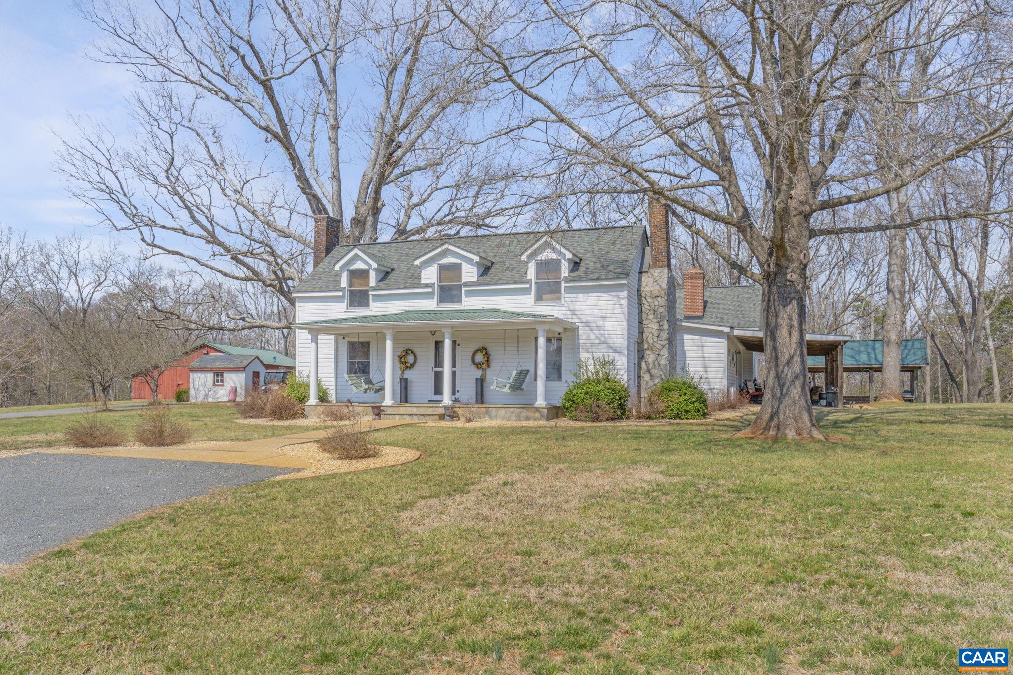 1353 Banton Shop Road Dillwyn, VA 23936 - Photo 53 of 57 a front view of residential houses with yard and trees