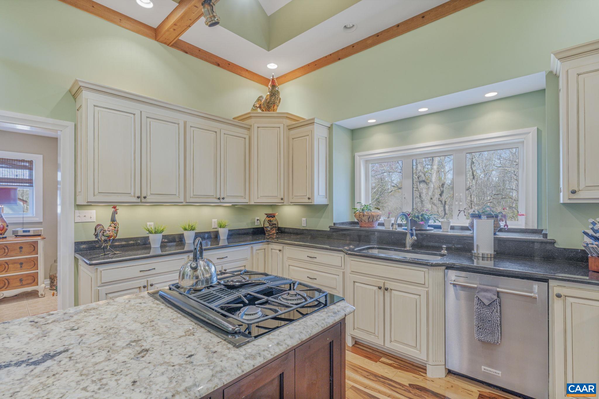 1353 Banton Shop Road Dillwyn, VA 23936 - Photo 8 of 57 a kitchen with stainless steel appliances granite countertop a stove sink and cabinets