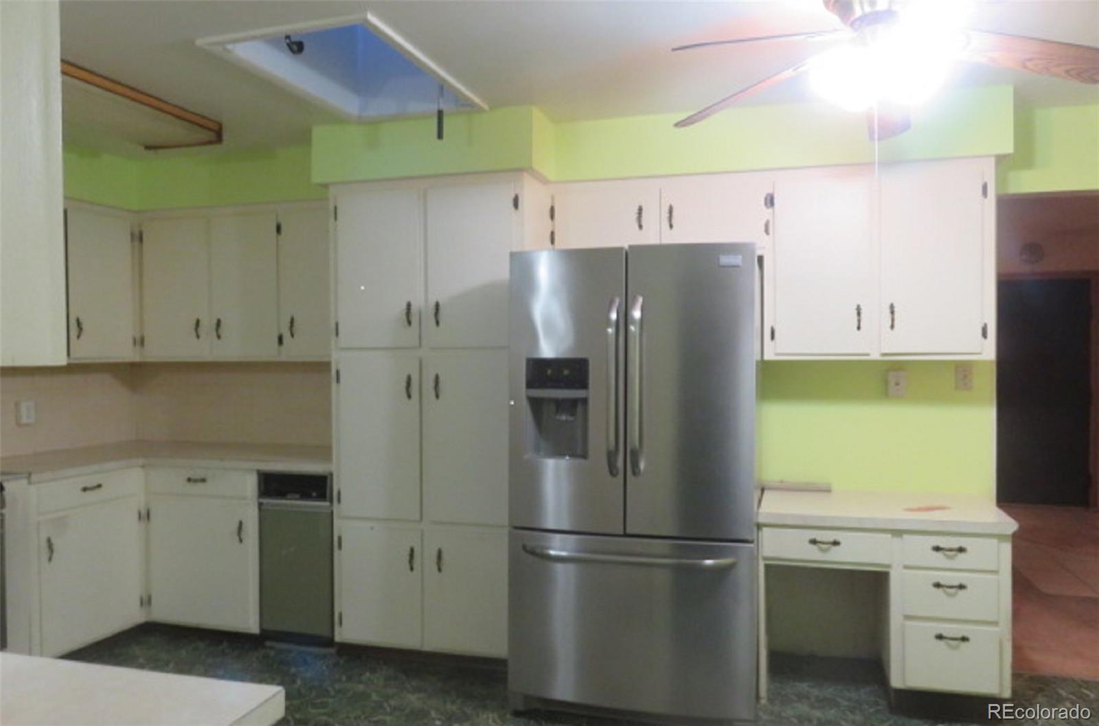 4935 Howell Street Golden, CO 80403 - Photo 12 of 34 a kitchen with stainless steel appliances a refrigerator and a stove