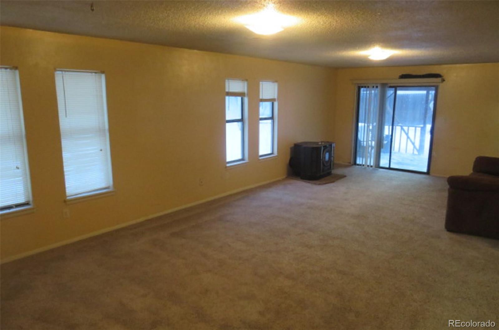 4935 Howell Street Golden, CO 80403 - Photo 13 of 34 a view of an empty room with a window