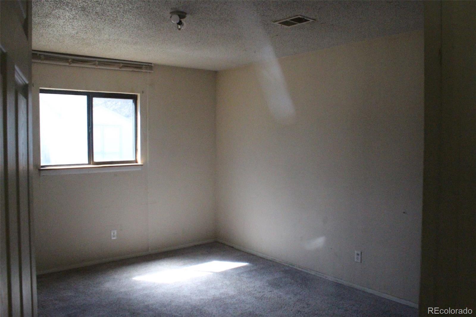 4935 Howell Street Golden, CO 80403 - Photo 15 of 34 a view of an empty room with a window