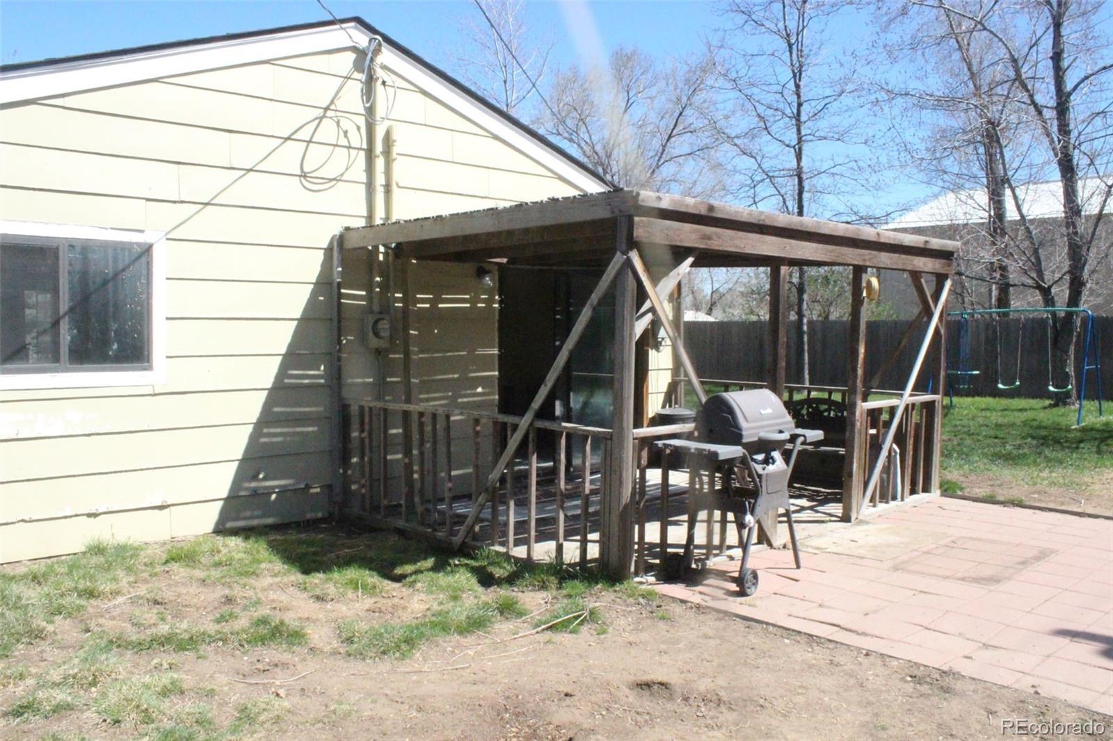 4935 Howell Street Golden, CO 80403 - Photo 16 of 34 a view of a patio with a table and chairs