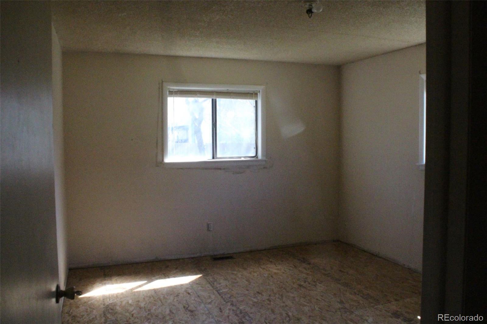 4935 Howell Street Golden, CO 80403 - Photo 19 of 34 an empty room with a window