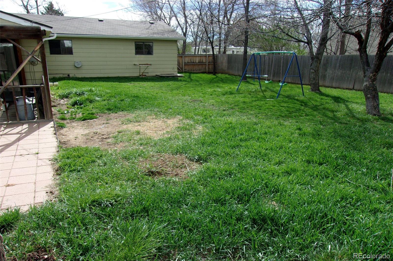 4935 Howell Street Golden, CO 80403 - Photo 2 of 34 a view of a house with a yard