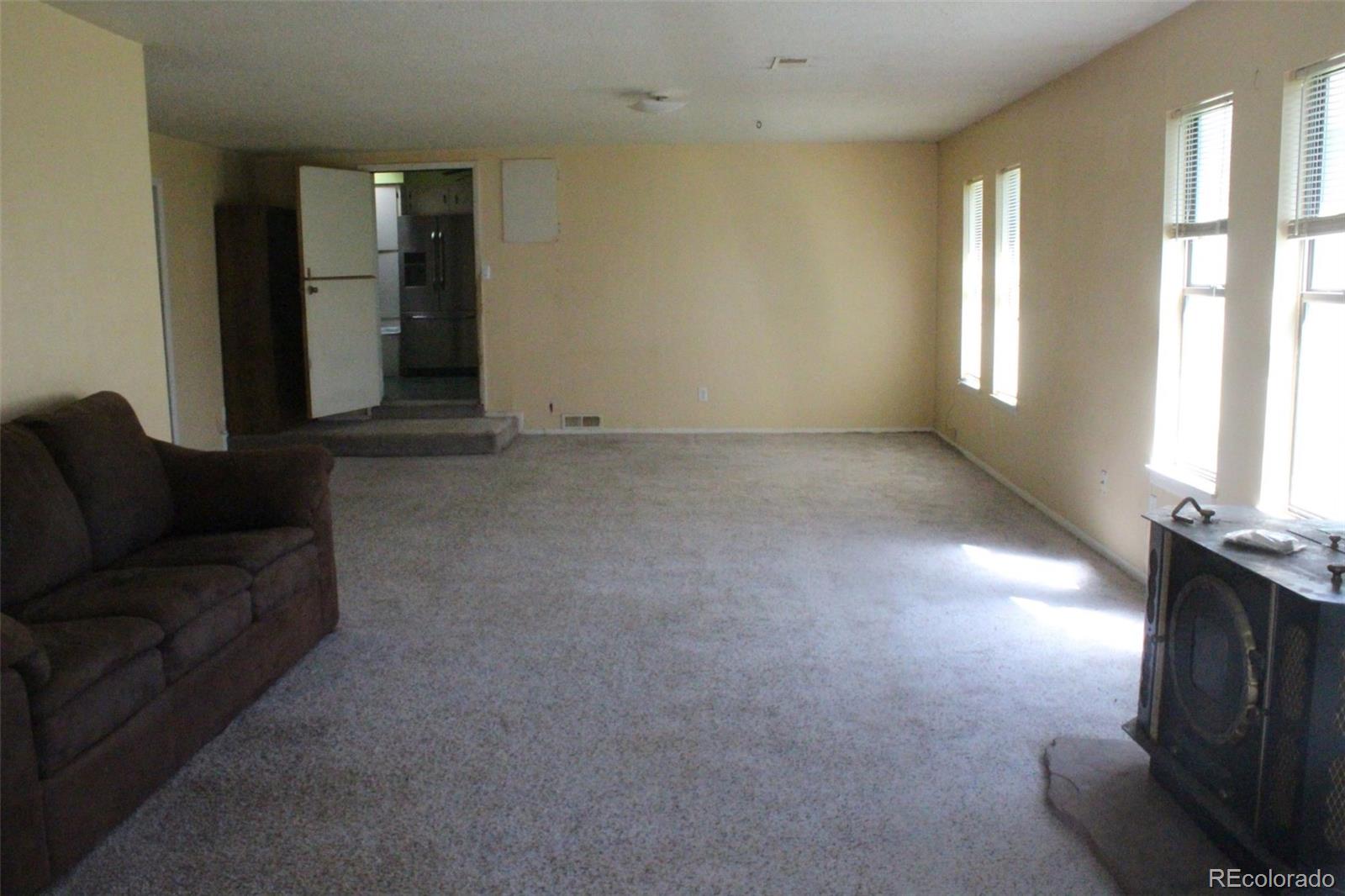 4935 Howell Street Golden, CO 80403 - Photo 21 of 34 a living room with furniture and a fireplace