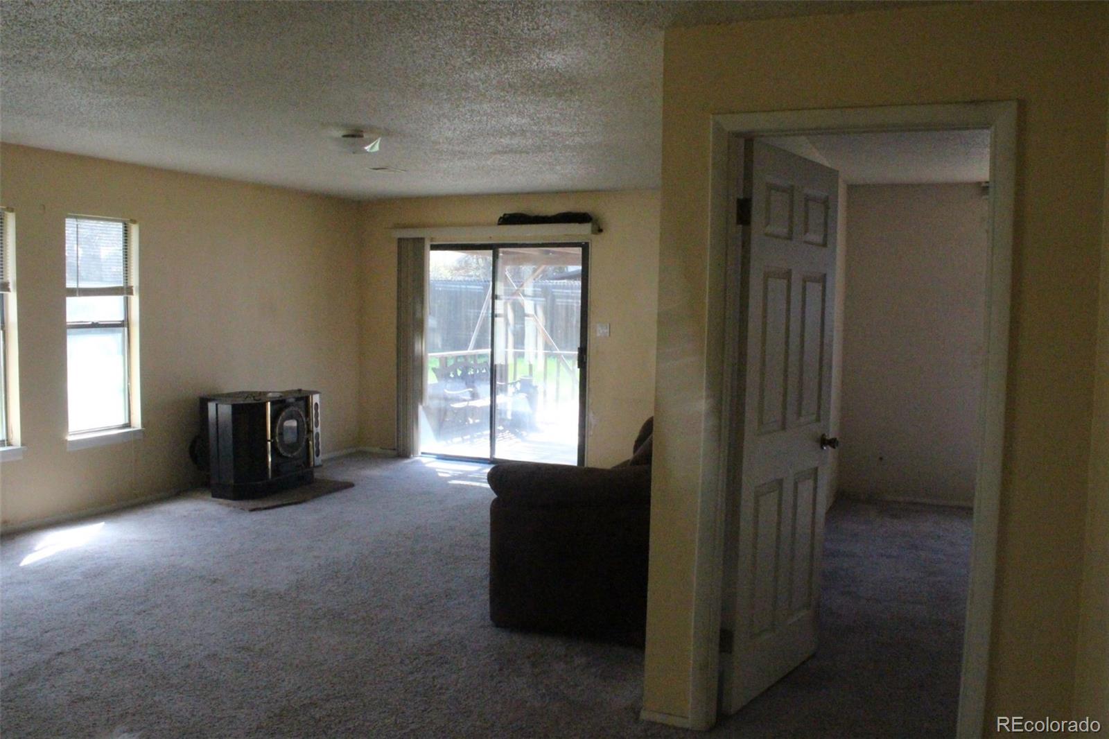 4935 Howell Street Golden, CO 80403 - Photo 22 of 34 an empty room with windows and closet