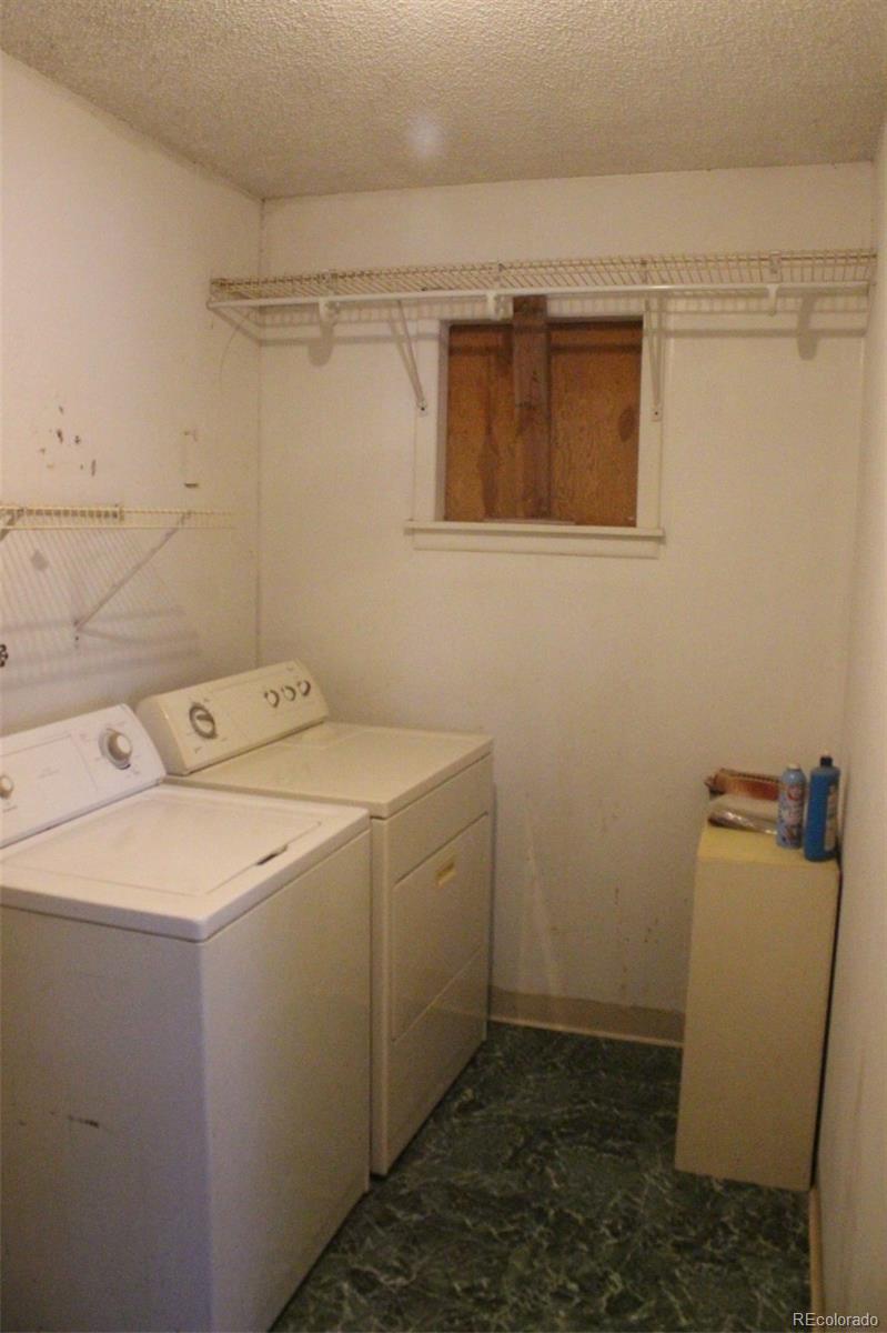 4935 Howell Street Golden, CO 80403 - Photo 26 of 34 a utility room with dryer and washer