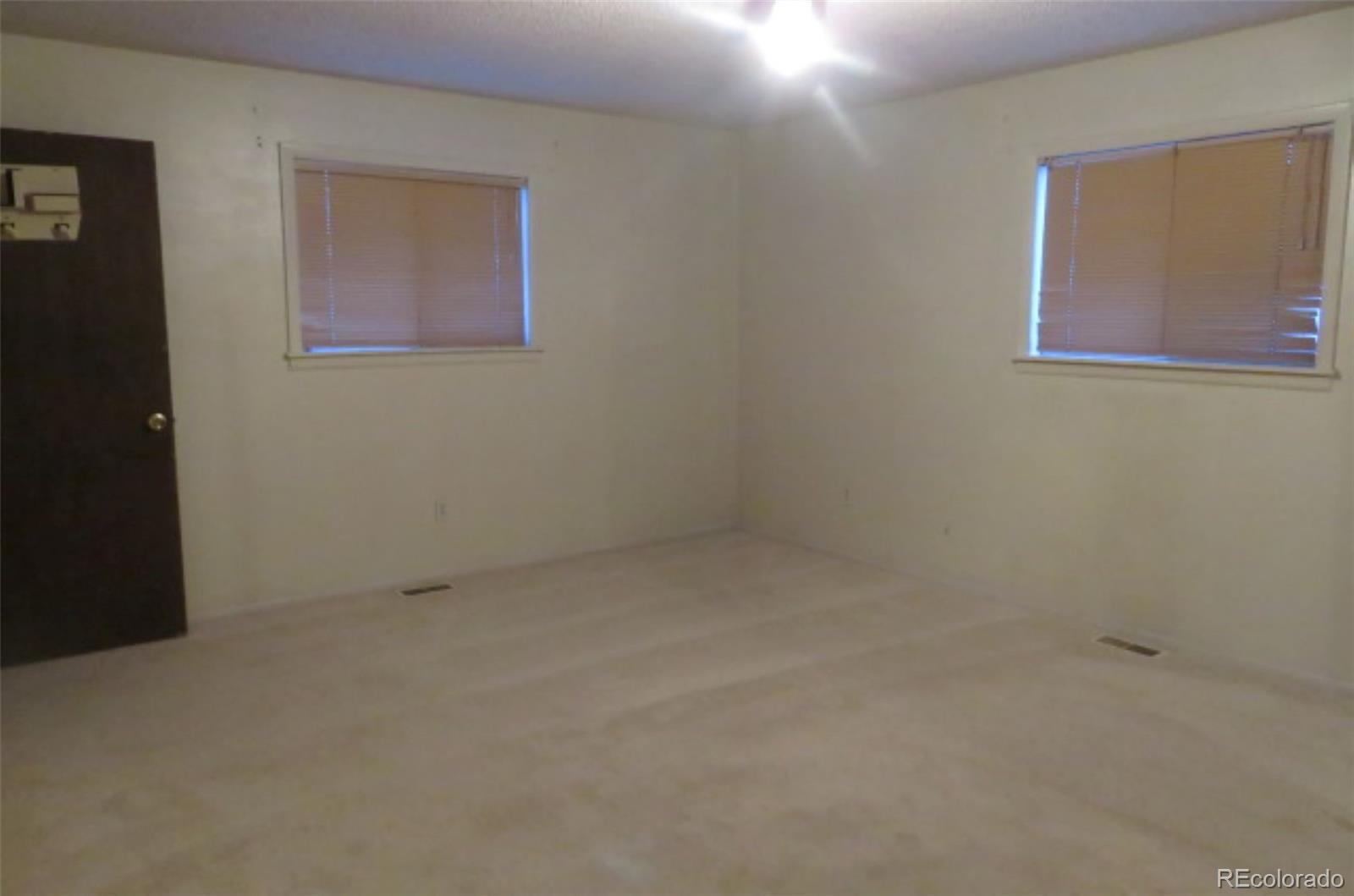 4935 Howell Street Golden, CO 80403 - Photo 29 of 34 an empty room with a window
