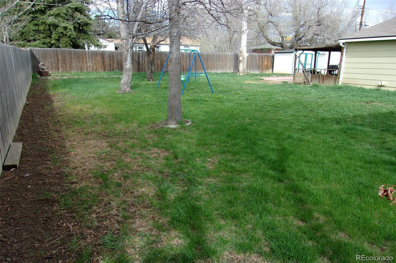 4935 Howell Street Golden, CO 80403 - Photo 4 of 34 a view of a yard with a house