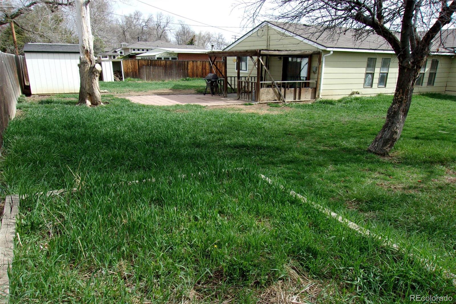 4935 Howell Street Golden, CO 80403 - Photo 5 of 34 a view of a house with a yard and a patio