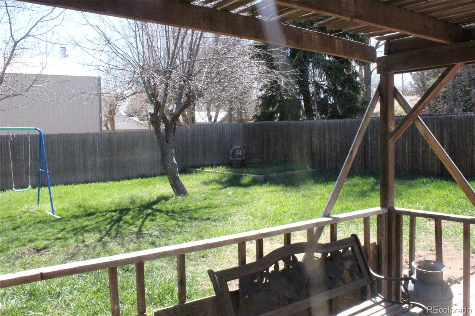 4935 Howell Street Golden, CO 80403 - Photo 8 of 34 a view of a deck with a backyard