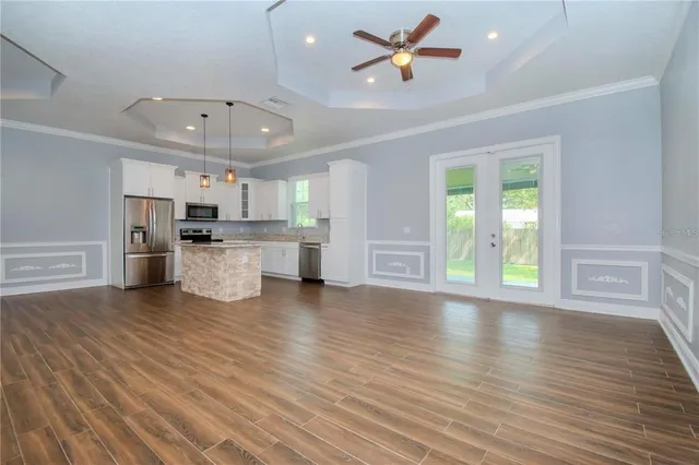 a view of a kitchen with a sink and a stove top oven
