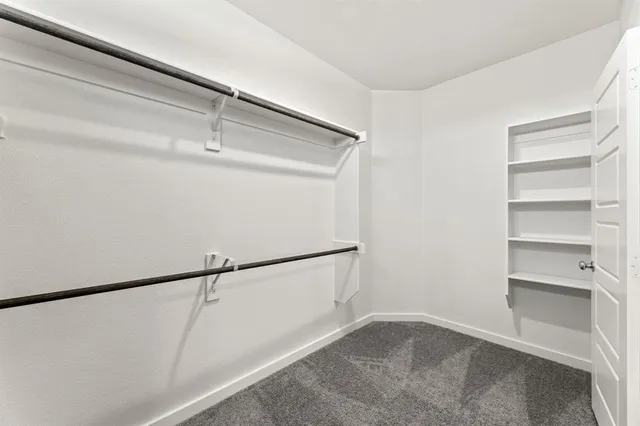 a view of an empty walk in closet