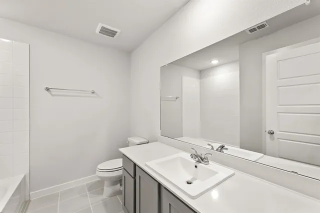 a bathroom with a sink toilet and vanity